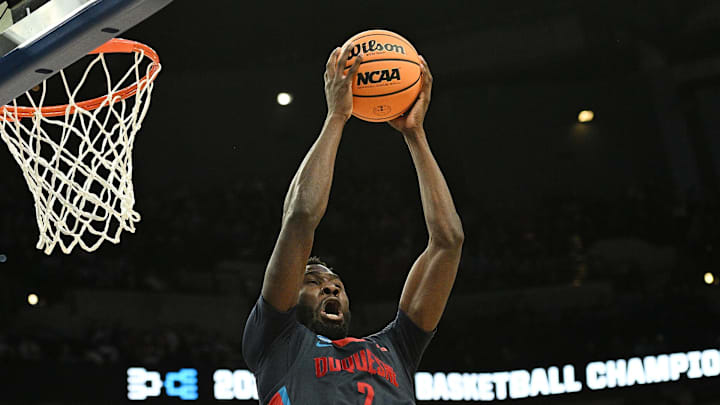 Mar 21, 2024; Omaha, NE, USA;  Duquesne Dukes forward David Dixon (2) grabs a second half rebound against the Brigham Young Cougars during the first round of the NCAA Tournament at CHI Health Center Omaha. Mandatory Credit: Steven Branscombe-Imagn Images