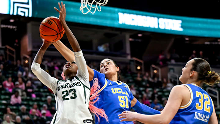 Michigan State's Jalyn Brown, left, is blocked by UCLA's Lauren Betts during the third quarter on Wednesday, Feb. 11, 2026, at the Breslin Center in East Lansing.