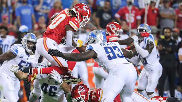 Detroit Lions defensive end Josh Paschal (93) tackles Kansas City Chiefs running back Isiah Pacheco during the second half at Arrowhead Stadium in Kansas City, Mo. on Thursday, Sept. 7, 2023.