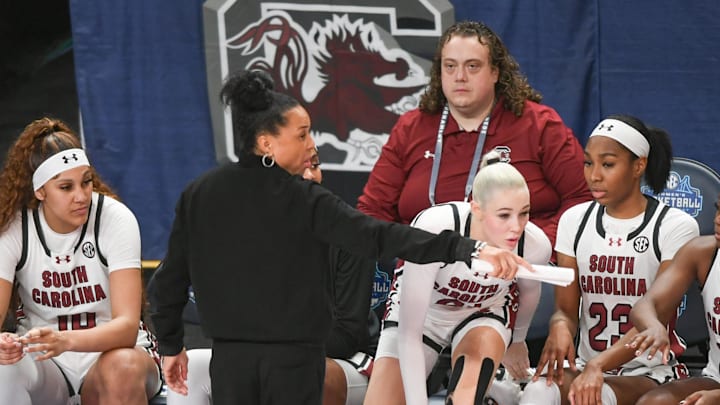 South Carolina basketball coach Dawn Staley with Kamilla Cardoso, Chloe Kitts, and Bree Hall