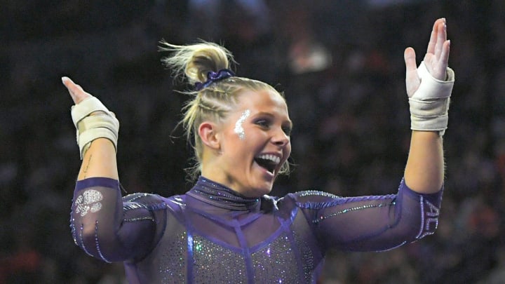 Clemson senior Rebecca Wells of Smyrna, Georgia reacts after finishing the beam during a gymnastics match at Littlejohn Coliseum in Clemson, S.C. Sunday, January 21, 2024.
