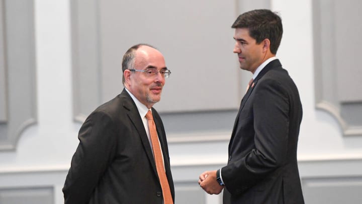 Graham Neff, right, Clemson University Athletic Director talks with Chip Harris, right, general counsel, before a hearing about Clemson and the ACC before Judge Perry H. Gravely, ruling on the university's motion for summary judgement and the conference's motion to dismiss, at the Pickens County Courthouse in Pickens, S.C. Friday, July 12, 2024.