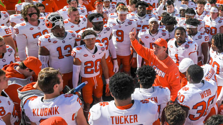 Clemson head coach Dabo Swinney talks with players before the TaxSlayer Gator Bowl with Kentucky at EverBank Stadium in Jacksonville, Florida, Friday, December 29, 2023.