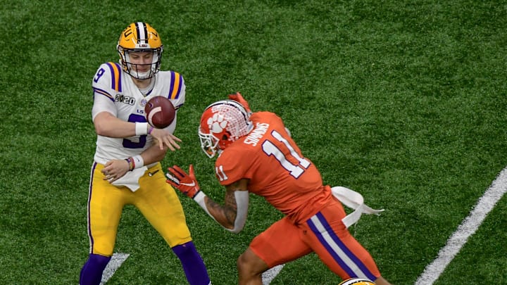 LSU quarterback Joe Burrow (9) throws near Clemson safety Isaiah Simmons (11) during the first quarter at the Mercedes Benz Superdome in the National Championship football game in New Orleans Monday, January 13, 2020.

Clemson Lsu Football Cfp National Championship New Orleans