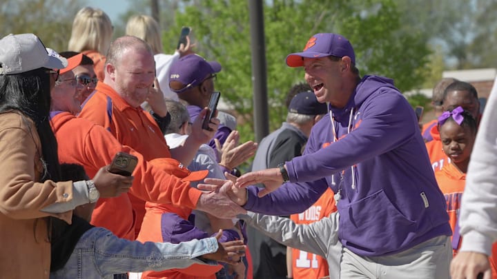 Clemson head coach Dabo Swinney waves to fans and greets them at Tiger Walk before the annnual Clemson Orange and White spring game at Memorial Stadium in Clemson, South Carolina Saturday, March 28, 2026.