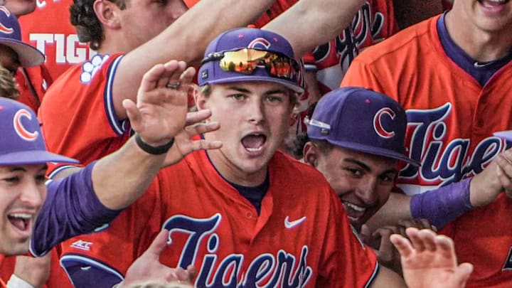 Clemson’s Jackson Moore (26) greets catcher Nate Savoie (99) after hitting a home run during the bottom of the fifth inning at Doug Kingsmore Stadium in Clemson, S.C. Friday, April 10, 2026. Moore went 2 for 4 with four RBI's in the Tigers 9-5 win over UNC.