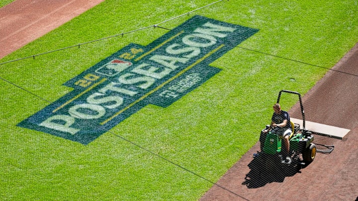 Members of the Brewers grounds crew prepare the field before the Tuesday Milwaukee Brewers National League Wild Card playoff series at American Family Field in Milwaukee on Monday, Sept. 30, 2024.