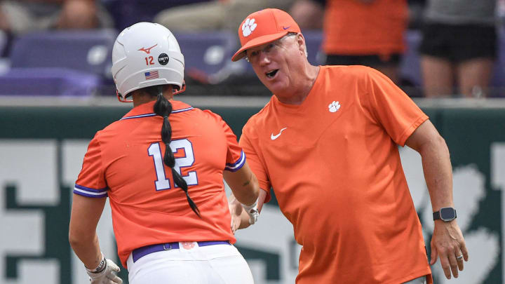 Clemson head coach John Rittman congratulates freshman Julia Knowler (12) as she hit a home run against Anderson University during the bottom of the first inning of the scrimmage at McWhorter Stadium in Clemson Friday, October 6, 2023.