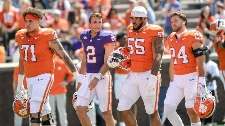 Clemson offensive lineman Tristan Leigh (71), Clemson quarterback Cade Klubnik (2), Clemson offensive lineman Harris Sewell (55) , and Clemson safety Tyler Venables (24)