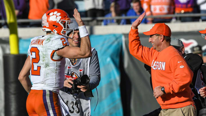 Clemson quarterback Cade Klubnik (2) gives a high five to Head Coach Dabo Swinney after the TaxSlayer Gator Bowl at EverBank Stadium in Jacksonville, Florida, Friday, December 29, 2023. Clemson beat Kentucky 38-35.