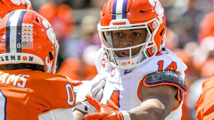 Clemson safety Rob Billings (14) reaches for Clemson wide receiver Antonio Williams(0) during the Spring football game in Clemson, S.C. Saturday, April 6, 2024.