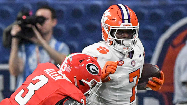 Aug 31, 2024; Atlanta, Georgia, USA; Clemson Tigers running back Phil Mafah (7) runs against Georgia Bulldogs linebacker CJ Allen (3) during the first quarter of the 2024 Aflac Kickoff Game at Mercedes-Benz Stadium. 