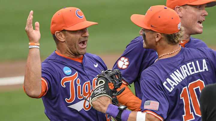 Jun 1, 2024; Clemson, South Carolina, USA; Clemson Tigers head coach Erik Bakich and outfielder Cam Cannarella (10) celebrate after defeating the Coastal Carolina Chanticleers at the Clemson Regional at Doug Kingsmore Stadium. 