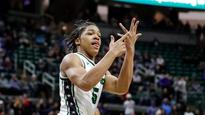 IMG Academy point guard Darius Acuff (5) celebrates a play against Muskegon during the second half of the MHSAA boys Division 1 final at Breslin Center in East Lansing, Michigan.