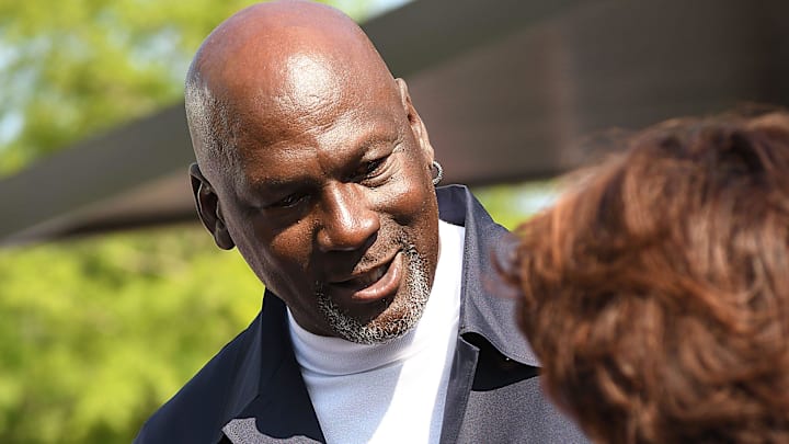 Michael Jordan takes the time to pose for a few photos and greet spectators and friends outside of The Michael Jordan Family Medical Clinic led by Novant Health. A ribbon cutting ceremony for the new clinic opening off of Greenfield Street Tuesday May 7, 2024 in Wilmington, N.C. KEN BLEVINS/STARNEWS