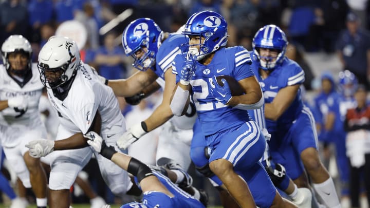 Sep 29, 2023; Provo, Utah, USA; Brigham Young Cougars running back LJ Martin (27) runs the ball in the first half against the Cincinnati Bearcats at LaVell Edwards Stadium. 