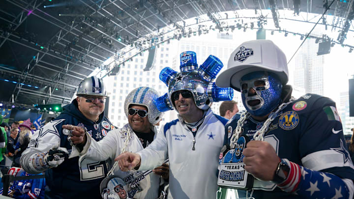 Dallas Cowboys fans pose in the main theater on Thursday, April 25, 2024 for the first day of the NFL Draft in Detroit.