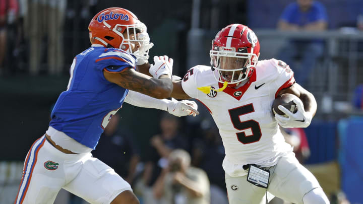 Oct 28, 2023; Jacksonville, Florida, USA; Georgia Bulldogs wide receiver Rara Thomas (5) runs against Florida Gators cornerback Jalen Kimber (8) in the first half at EverBank Stadium. Mandatory Credit: Jeff Swinger-USA TODAY Sports