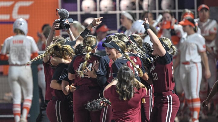 South Carolina Gamecocks celebrate after the game at McWhorter Stadium in Clemson Wednesday, March 20, 2024. USC won 6-4 in 12 innings.