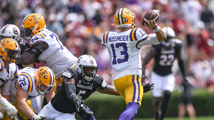 Louisiana State University quarterback Garrett Nussmeier (13) passes near South Carolina edge Kyle Kennard (5) during the second quarter at Williams-Brice Stadium in Columbia, S.C. Saturday, September 14, 2024.