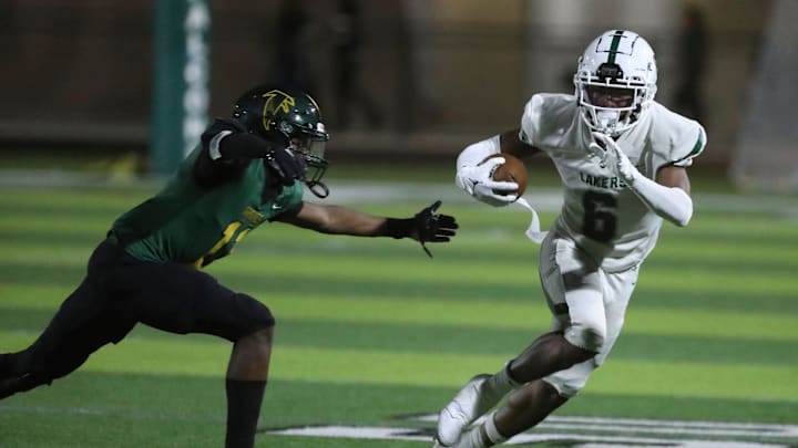 West Bloomfield receiver Karem Flowers runs the ball against Birmingham Groves during second-half action at Birmingham Groves on Thursday, Aug. 31, 2023. West Bloomfield receiver Karem Flowers runs the ball against Birmingham Groves during second-half action at Birmingham Groves on Thursday, Aug. 31, 2023.