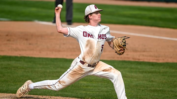 Okemos' Keagan Noble pitches to a Portland batter in the third inning on Monday, June 2, 2025, during the Diamond Classic semifinal at McLane Stadium in East Lansing. Okemos' Keagan Noble pitches to a Portland batter in the third inning on Monday, June 2, 2025, during the Diamond Classic semifinal at McLane Stadium in East Lansing.