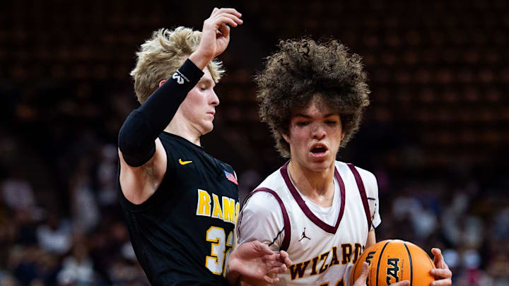 Windsor's Thales Price drives through Rams player Ben Swanson(32) during the Colorado Class 5A boys basketball state title game against Green Mountain on Saturday, March 15, 2025 at the Denver Coliseum in Denver, Colo. Windsor's Thales Price drives through Rams player Ben Swanson(32) during the Colorado Class 5A boys basketball state title game against Green Mountain on Saturday, March 15, 2025 at the Denver Coliseum in Denver, Colo.