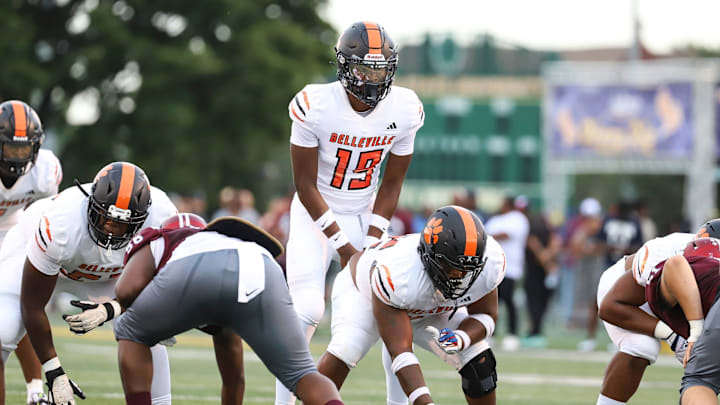 Belleville quarterback Bryce Underwood (19) calls for a snap against River Rouge during the first half of Prep Kickoff Classic at Wayne State University's Tom Adams Field in Detroi on Friday, August 25, 2023.