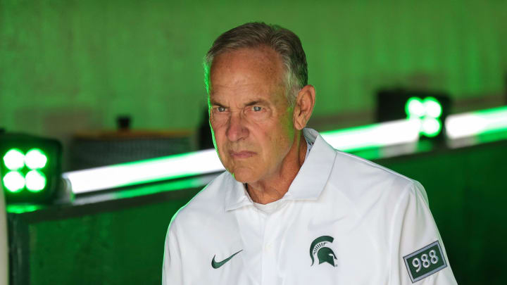 Former Michigan State head coach Mark Dantonio walks up the tunnel for warm up before the Maryland
