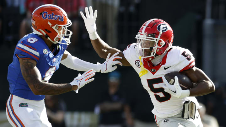 Oct 28, 2023; Jacksonville, Florida, USA; Georgia Bulldogs wide receiver Rara Thomas (5) runs against Florida Gators cornerback Jalen Kimber (8) in the first half at EverBank Stadium. Mandatory Credit: Jeff Swinger-USA TODAY Sports