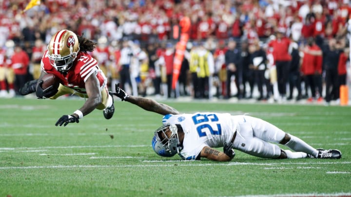 49ers wide receiver Brandon Aiyuk catches the ball over Lions cornerback Kindle Vildor in the third quarter of the NFC championship game at Levi's Stadium in Santa Clara, California, on Sunday, Jan. 28, 2024.