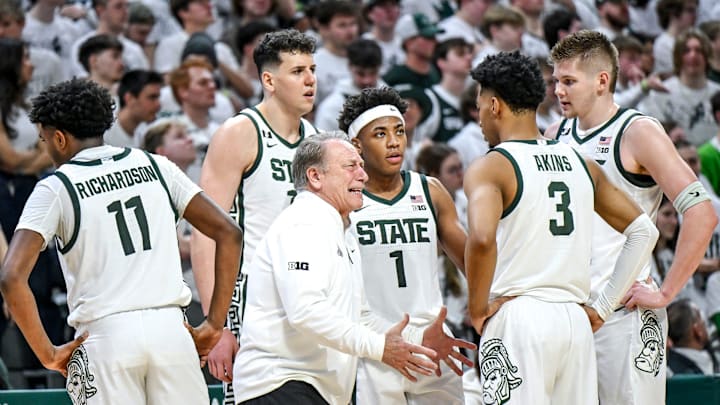 Michigan State coach Tom Izzo talks with his team during a timeout.