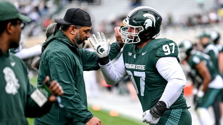 Michigan State's Maverick Hansen, right, works with defensive line coach Legi Suiaunoa during the Spring Showcase on Saturday, April 20, 2024, at Spartan Stadium in East Lansing.