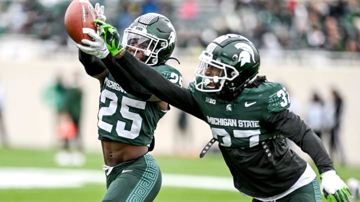 Michigan State's Khary Crump, right, and Chance Rucker run a drill during the Spring Showcase on Saturday, April 20, 2024, at Spartan Stadium in East Lansing.