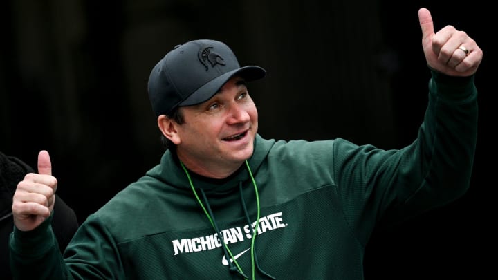 Michigan State's head coach Jonathan Smith gives a thumbs up to the crowd as he enters the field during the football Spring Showcase on Saturday, April 20, 2024, at Spartan Stadium in East Lansing.