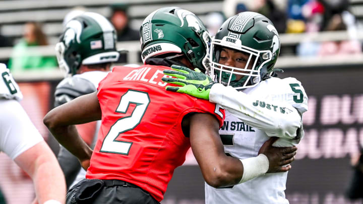 Michigan State's Aidan Chiles, left, celebrates with Nathan Carter after Carter's touchdown catch during the Spring Showcase on Saturday, April 20, 2024, at Spartan Stadium in East Lansing.