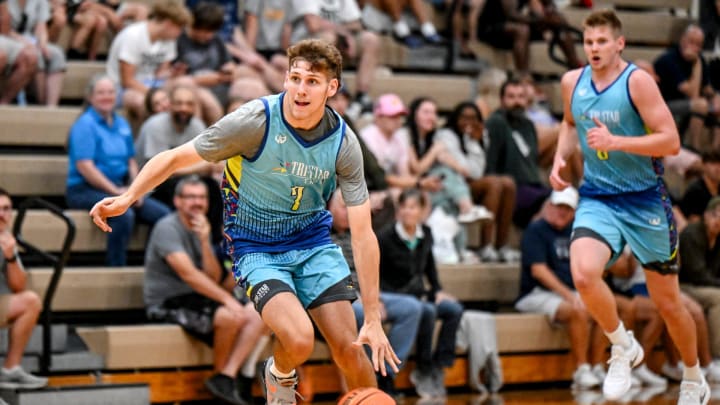 Michigan State and Team Tri-Star Trust's Gehrig Normand moves the ball in the game against Team Motorcars on Tuesday, June 25, 2024, during the Moneyball Pro-Am at Holt High School.