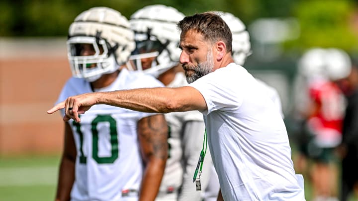 Michigan State's defensive coordinator Joe Rossi works with the defense during the first day of football camp on Tuesday, July 30, 2024, in East Lansing.