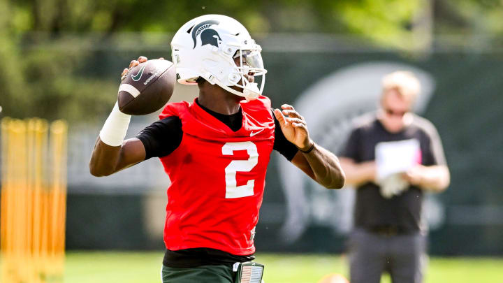 Michigan State's quarterback Aidan Chiles throws a pass during the first day of football camp on Tuesday, July 30, 2024, in East Lansing.