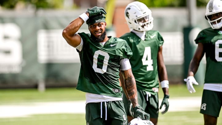 Michigan State's Alante Brown takes a break during the first day of football camp on Tuesday, July 30, 2024, in East Lansing.