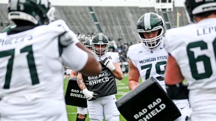 Michigan State's offensive line runs a drill during the Spring Showcase on Saturday, April 20, 2024, at Spartan Stadium in East Lansing.