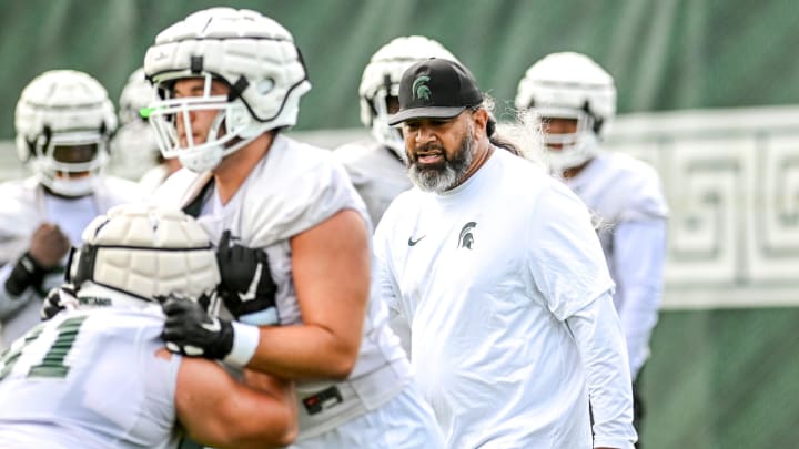 Michigan State's defensive line coach Legi Suiaunoa works with players during the first day of football camp on Tuesday, July 30, 2024, in East Lansing.