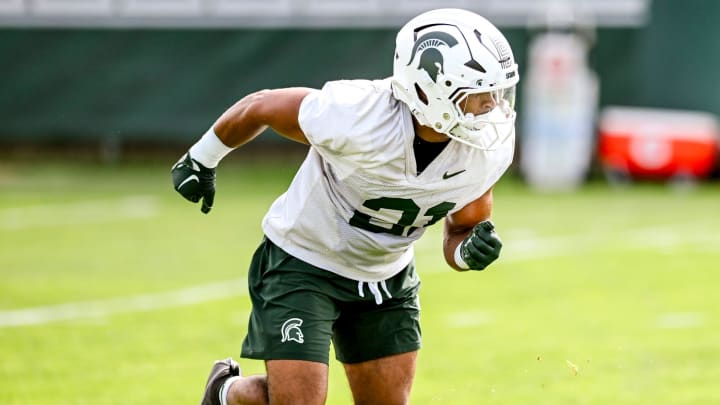 Michigan State's Dillon Tatum runs a drill during the first day of football camp on Tuesday, July 30, 2024, in East Lansing.