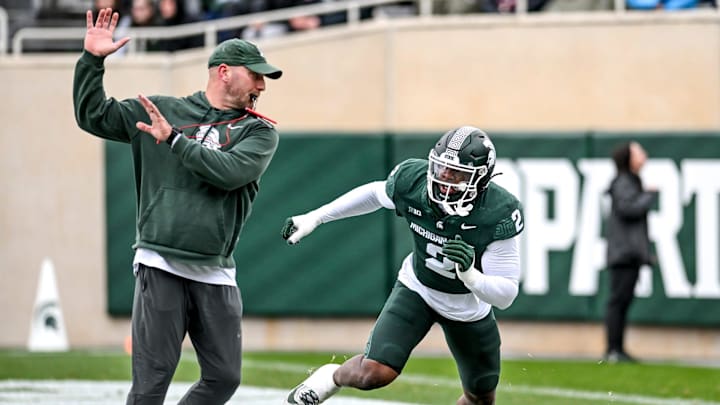 Michigan State's Khris Bogle, right, runs a drill with rush ends coach Chad Wilt during the Spring Showcase on Saturday, April 20, 2024, at Spartan Stadium in East Lansing.