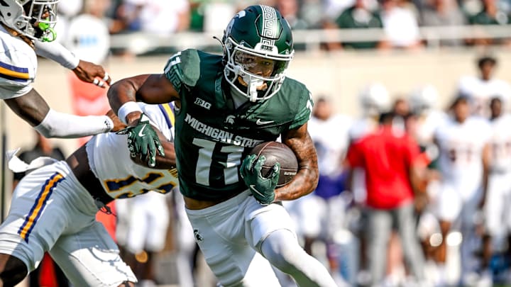 Michigan State's Aziah Johnson breaks tackles on his way to a touchdown against Prairie View A&M during the first quarter on Saturday, Sept. 14, 2024, at Spartan Stadium in East Lansing.