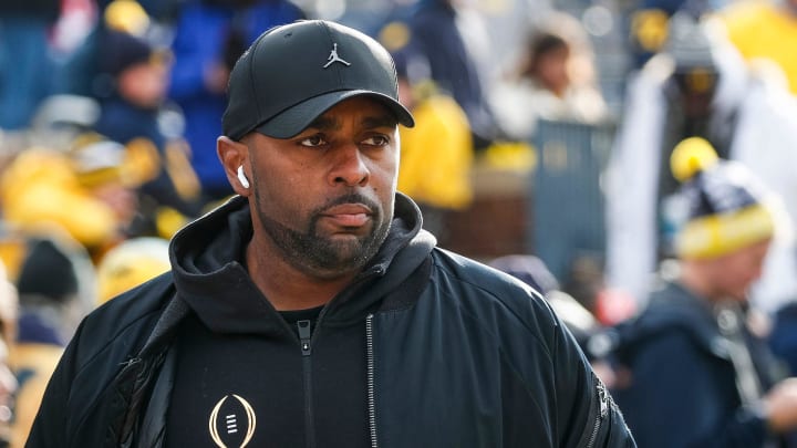 Michigan offensive coordinator and acting head coach Sherrone Moore watches warmups before the Ohio State game at Michigan Stadium in Ann Arbor on Saturday, Nov. 25, 2023.