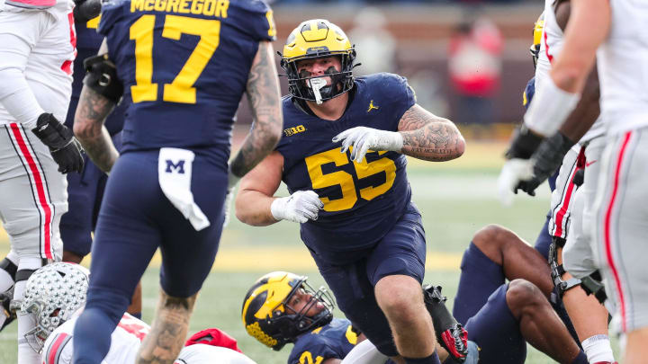 Michigan defensive lineman Mason Graham celebrates a tackle against Ohio State quarterback Kyle McCord during the second half at Michigan Stadium in Ann Arbor on Saturday, Nov. 25, 2023.