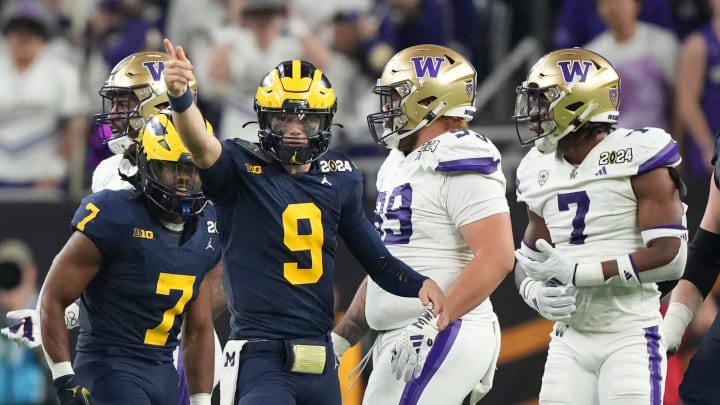 Michigan quarterback J.J. McCarthy points down the field during the second half of the College Football Playoff national championship game against Washington at NRG Stadium in Houston, Texas on Monday, Jan. 8, 2024.