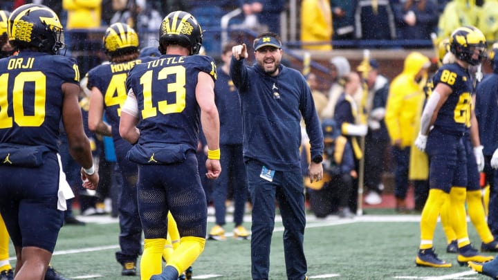 Michigan quarterbacks coach Kirk Campbell watches warmups before the Indiana game at Michigan Stadium in Ann Arbor on Saturday, Oct. 14, 2023.