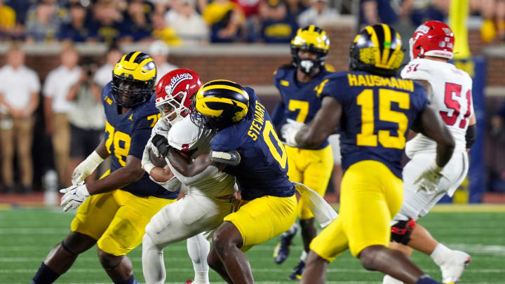 Michigan edge rusher Josaiah Stewart (0) tackles Fresno State running back Malik Sherrod (2) during the second half at Michigan Stadium in Ann Arbor on Saturday, Aug. 31, 2024.